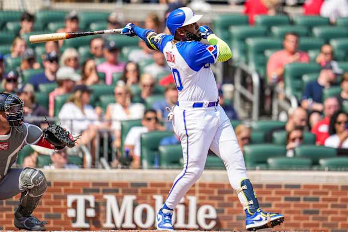Jun 10, 2023; Cumberland, Georgia, USA; Atlanta Braves designated hitter Marcell Ozuna (20) hits a home run against the Washington Nationals during the second inning at Truist Park. Mandatory Credit: Dale Zanine-USA TODAY Sports